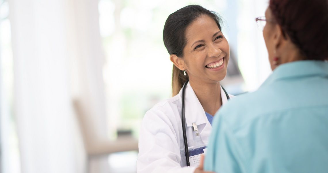 Female Physician consulting with a patient